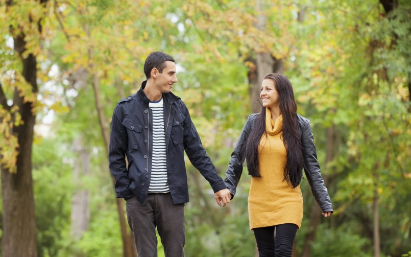 Couple at the park in autumn time